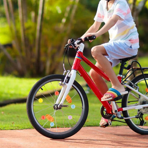 Child riding bike with 30 pcs flower shaped bicycle spoke beads set for wheel spokes plastic clip beads decorations.