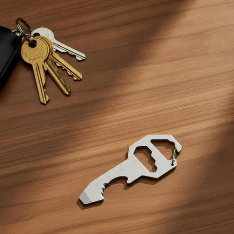 Ultra Slim Metal Multi-Tool Card With Bottle Opener And Hex Wrench For Wallet Or Keychain on wooden surface