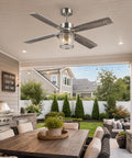 TALOYA 52" Farmhouse Ceiling Fan with Light and Remote, Rustic Style, suspended over patio dining area with textured glass shade.