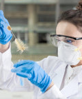 Scientist using 4 Piece Lab Flask Brush Set for 250ml volumetric flasks, glass tubes and beakers cleaning with pro grade bristles.