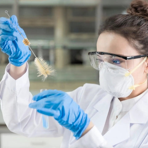 Scientist using 4 Piece Lab Flask Brush Set for 250ml volumetric flasks, glass tubes and beakers cleaning with pro grade bristles.