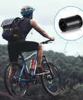 Cyclist with bike showing Bullet Style Valve Stem Caps Aluminum Alloy Built Tough Dustproof Waterproof, Black and Titanium.