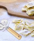 Sibba fluted double-wheel pastry cutter with wooden handle for ravioli and pasta dough.