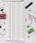Triple 830 Point Solderless Breadboard Kit For DIY Makers Prototyping Arduino And Raspberry Pi Projects, surrounded by components.