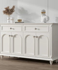 Top Shelf Brushed Nickel Cabinet Knobs on a white dresser with drawers and decorative items, rust resistant hardware.