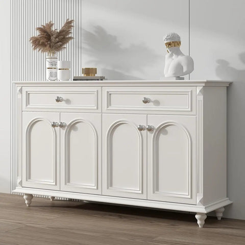 Top Shelf Brushed Nickel Cabinet Knobs on a white dresser with drawers and decorative items, rust resistant hardware.