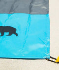 Lightweight Beach Tent Stakes Pack Of Four 5.9 Inch Sand Tarp Pegs With Anchor for securing blue and gray tarp on sand