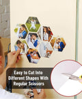 Person cutting Non Adhesive Magnetic Sheets 8.5 By 11 Inches 30 Mil Thick into hexagon shapes, affixing photos, highlights flexibility.