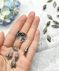Kickass Diamond Shape Rivets With Screw Back Studs For Leather Crafting and Jacket Embellishment Heavy Duty Zinc Alloy, showing rivets in hand.