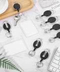 20 Pack Retractable Badge Reels With Carabiner, Heavy Duty ID Badge Holders And Key Chain Clips displayed on a desk