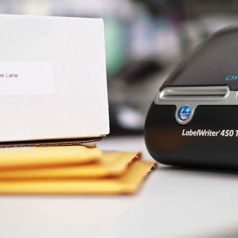 Straight Up Twin Turbo Direct Thermal Label Printer With Dual Roll Setup For Fast Shipping Labels And Office Grind Ink Free Speed for barcodes next to shipping box.