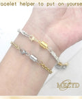 Person wearing Magnetic Necklace Clasp With Lobster Clasp 14K Gold And Silver Magnetic Jewelry Clasps For Bracelet Closures.
