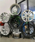 Heavy Duty Stackable Tire Rack Organizer For Garage And Workshop Storage Space Saving Wheel Display Stand with wheels in hexagon design.