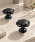 Slick Matte Black Cabinet Knobs Heavy Duty Zinc Alloy, round shape, smooth grip, suitable for cupboards and drawers.