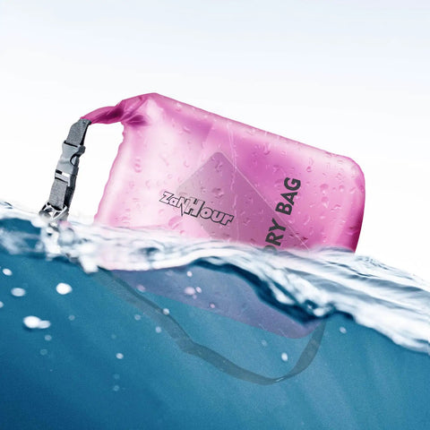 Pink waterproof roll top dry bag floating in water, part of the Waterproof Roll Top Dry Bag Set 2L 5L 10L 20L for Travel And Adventure Kayaking