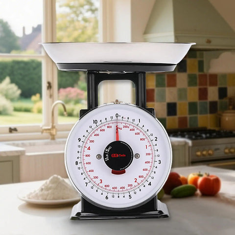 11 Lb Analog Kitchen Scale With Stainless Steel Bowl on a kitchen counter, showing mechanical food weighing dial and removable bowl