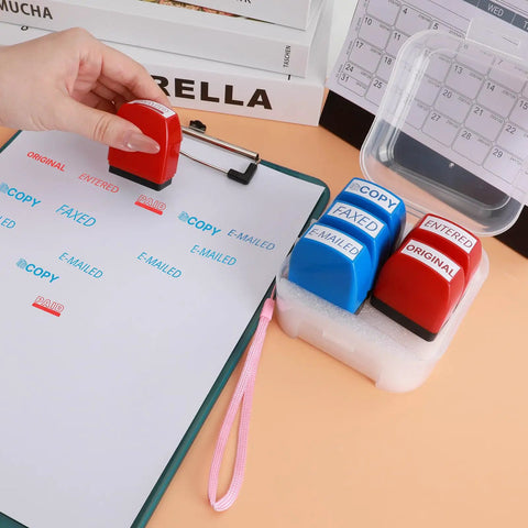 Nifty Six Piece Self Ink Rubber Stamp Set With Vivid Red And Navy Blue Office Stamps on a clipboard for efficient marking.