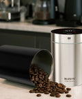 Top Shelf Automatic Vacuum Coffee Canister With Stainless Steel Build Digital Display showing coffee beans and sleek black design.