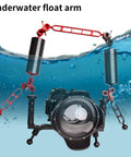 Red 10-Inch Carbon Fiber Underwater Float Arm 2-Pack Ultralight Buoyancy System attached to diving camera tray submerged in water