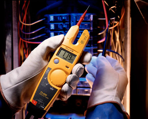 Non Contact Voltage And Current Tester With Auto AC DC Detection, Measures Up To 600 V And 100 A, in use by electrician.