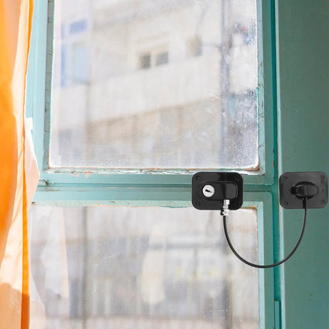 Multifunction Safety Cabinet Lock With Key For Cabinets And Fridges Black Plastic Door Lock And Window Limiter shown installed on window