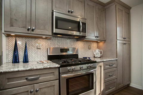 Kitchen scene featuring Weathered Nickel Drawer Handles Six Pack With 5.04 Inch Center To Center Antique Iron Cabinet Pulls on cabinets.