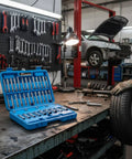 Open Shock Absorbing Tool Kit With Impact Resistant Dampening System For Strut Upper Mount Nut Socket Set in auto repair shop