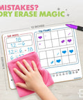 Child erases Double-Sided Dry Erase Math Board For Kids With Bar Model, Ten Frame, Number Line, And 1 To 120 Chart