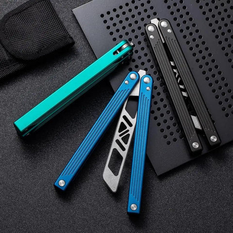 Integrated Forging Bushing System Flip Knife With T6061 Channel Handle For Ultra Smooth Flips Dope Blue Finish visible on table