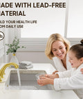 Woman and child using Brushed Gold Widespread 8 Inch 2-Handle Bathroom Faucet With 3-Hole Setup And Metal Pop Up Drain.