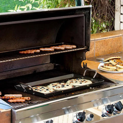 Seasoned Carbon Steel Griddle With Dual-Handle Flat Top For Stovetop, Oven, And Grill, Lightweight And Fast-Heating Pan on a grill