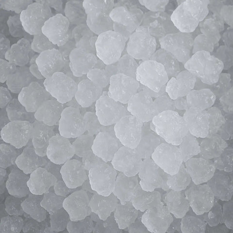 Countertop Nugget Ice Maker With Dispenser Churning Out Chewable Flake Ice On The Fly With Up To Three Hundred Fifty Pounds Daily Production Featuring Hassle Free Cleaning Panels For Your Bar Or Kitchen - close-up of soft nugget ice pieces.