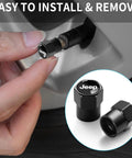 Person installing Jeep Tire Valve Stem Caps Aluminum Alloy Anodized 4 Pack Black Car Wheel Air Caps Durable Valve Covers.