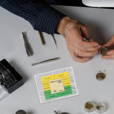 Essential Stainless Steel Watch Repair Screw Set Including Ten Individual Micro Screw Varieties for watch maintenance tools on workbench.