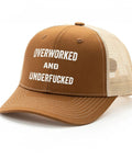Brown Low Profile Distressed Trucker Cap For Women with bold white text, beige mesh back, lightweight washed cotton baseball hat.