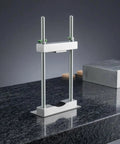 Cello Head Clamp For Violin Family Instruments Go To Pro Luthier Bench Fixture With Secure Holding And Repeatable Positioning For Instrument Building And Repair In Workshop With Cushioned Touch Area silver metal clamp on granite workbench