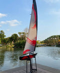 84 Inch Remote Control Sailboat Kit With Preassembled Accessories, 2.4G RC Watercraft in outdoor setting with canvas sail