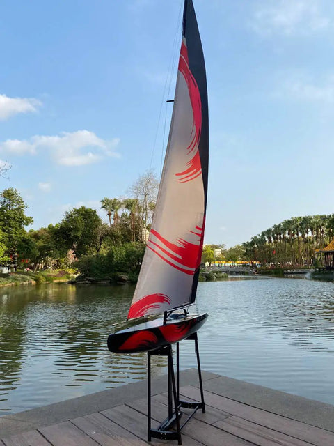 84 Inch Remote Control Sailboat Kit With Preassembled Accessories, 2.4G RC Watercraft in outdoor setting with canvas sail