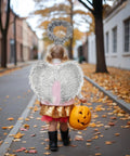 Girl in costume with Silver Angel Wings Set With Headband For Cosplay And Party Nights, delicate feather wings, holding pumpkin bucket.