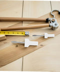 Flat Head Screwdrivers Duo Pack For Sewing Machines Precision Mini Tools on a wooden table with a tape measure and tool handle