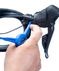 Using EWS-2 Bicycle Electronic Shift Tool For Shimano EW-SD3000 Wires And Batteries to adjust bike gear shifter.