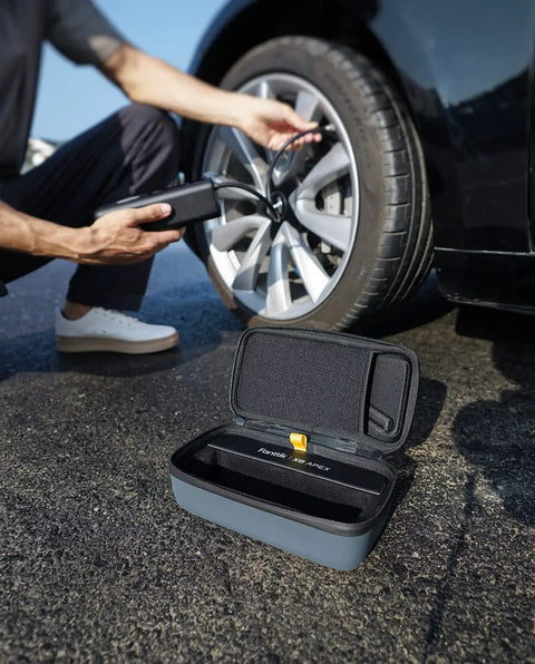 Officially Customized EVA Storage Case For X8 APEX Tire Inflator And S100 Kit on the ground near inflating tire