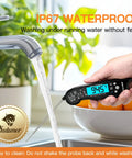 Instant Read Meat Thermometer with folding 4.6 inch stainless steel probe under running water, showing waterproof feature