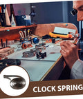 Watchmaker using Steel Mainspring Clock Repair Kit For Mechanical Alarm Clocks 3 Pack Replacement Parts on workbench.