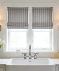 Boho Industrial Wall Sconce Set Of 2 with brass antique finish and champagne fabric shade installed above kitchen sink