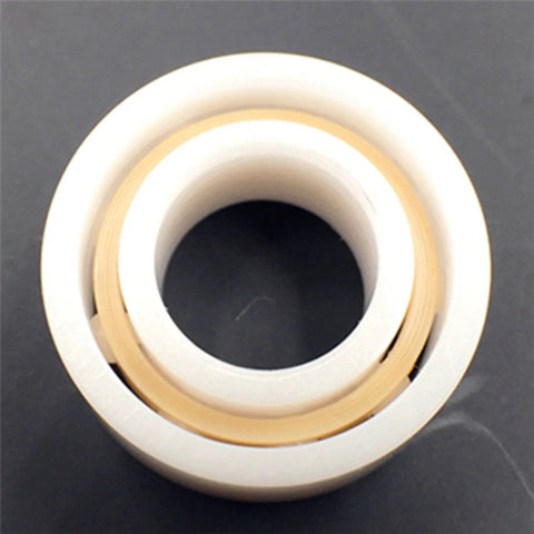 R188 full ceramic bearing, 1/4 in x 1/2 in x 3/16 in, white outer race with gold inner ring, front view