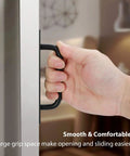 Hand gripping black barn door handle, demonstrating easy install and grip friendly Black Barn Door Handles 4 Pack With 5 Inch Hole Center Aluminum Sliding Door Pulls For Pocket Doors Bifold Closets Hardware Replacement Durable Rust Resistant Grip Friendly Easy Install