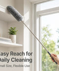 All In One 2 Pack Microfiber Feather Duster Set With Extendable Pole in use cleaning a bookshelf near a window
