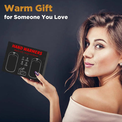 Woman holding 2 Pack Rechargeable Hand Warmers Portable Pocket Heaters For Men Women Kids Get Warm Fast Up To 131F box