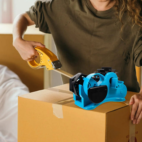 Semi Automatic Heat Tape Cutter With Compact Desktop Packing Station And Lightweight Tape Holder For Quick Box Sealing And Top Shelf Shipping Hustle The Reliable Gadget For Smooth Tape Dispensing Routine Blue in use on a cardboard box.